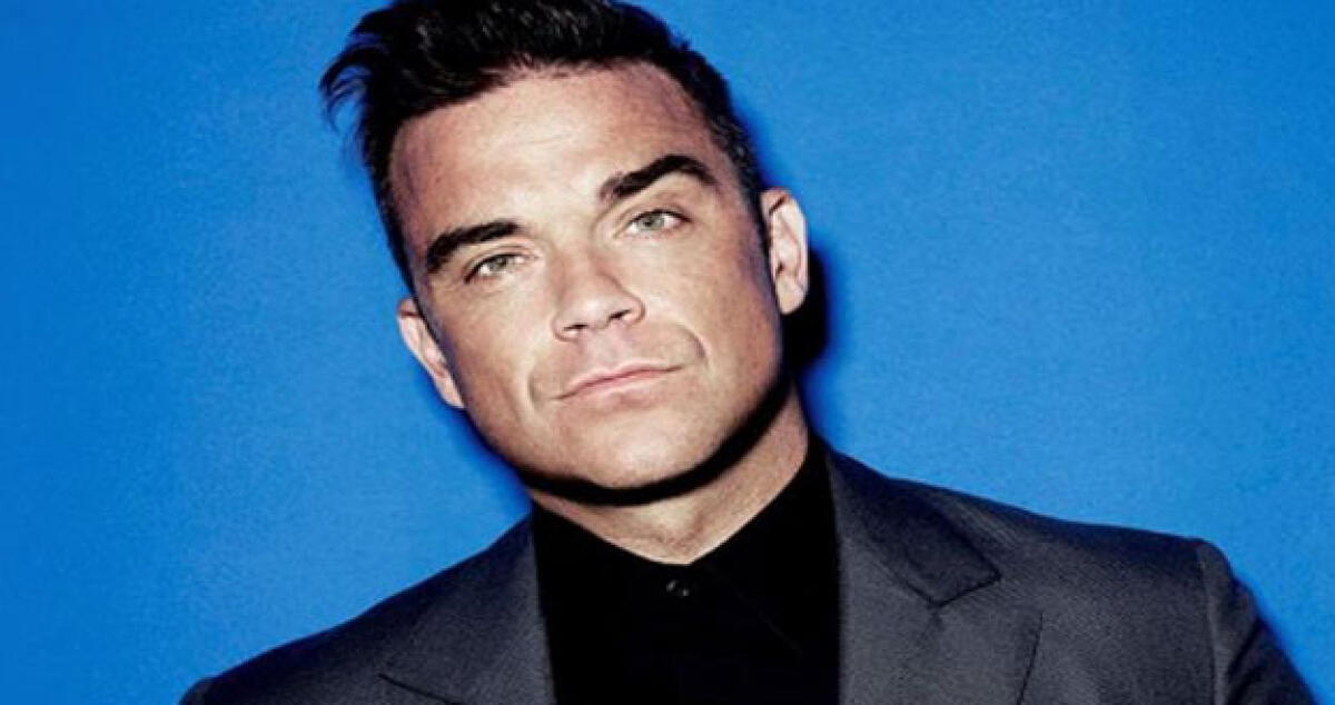 Robbie  Williams cade dal Palco e rompe il braccio a una fan - 
